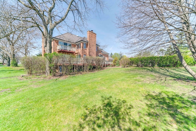 view of yard with a balcony