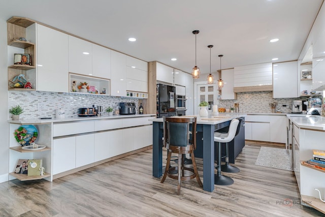 kitchen featuring open shelves and modern cabinets