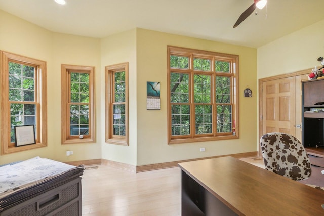 office with baseboards, light wood-type flooring, recessed lighting, and a ceiling fan