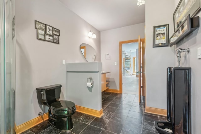 bathroom featuring vanity and baseboards