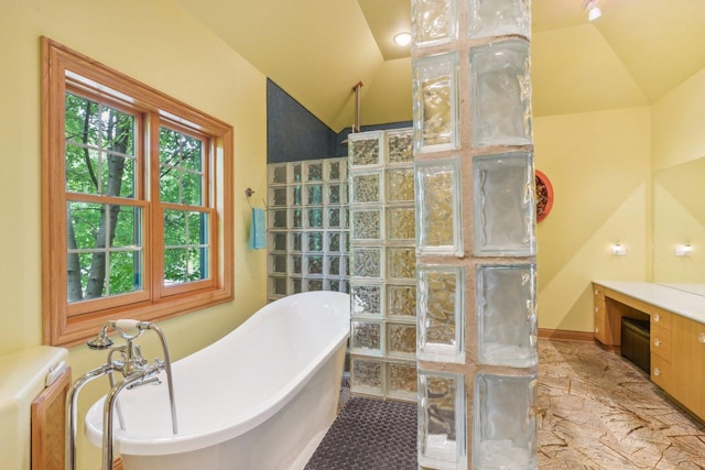 bathroom with a soaking tub, walk in shower, and lofted ceiling