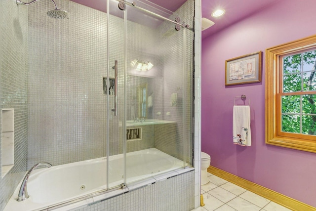 full bathroom with tile patterned flooring, baseboards, and toilet