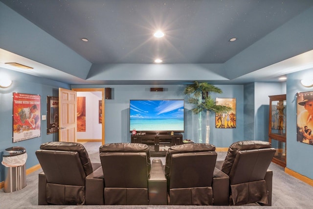 cinema with a tray ceiling, recessed lighting, carpet, and baseboards