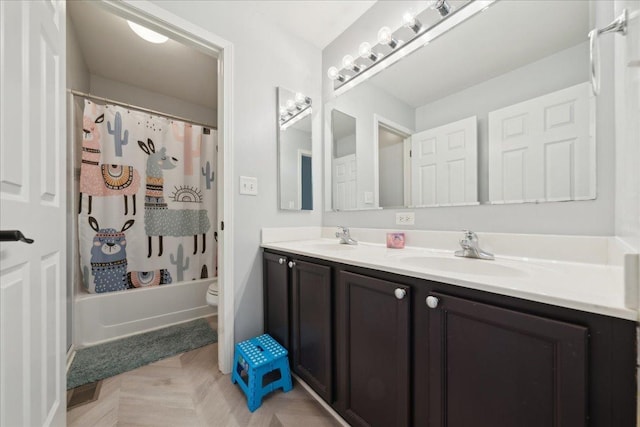 bathroom featuring double vanity, toilet, shower / bath combination with curtain, and a sink
