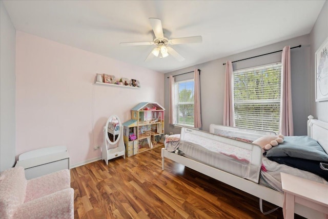 bedroom with ceiling fan and light wood-style flooring