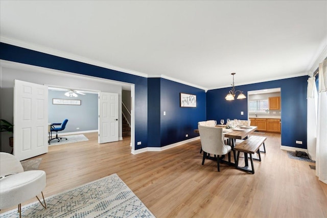 dining area with baseboards, light wood-style flooring, stairs, and a chandelier