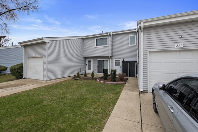 277 E Alpine Dr, Glendale Heights, IL 60139 - view of front facade with a front yard and a garage