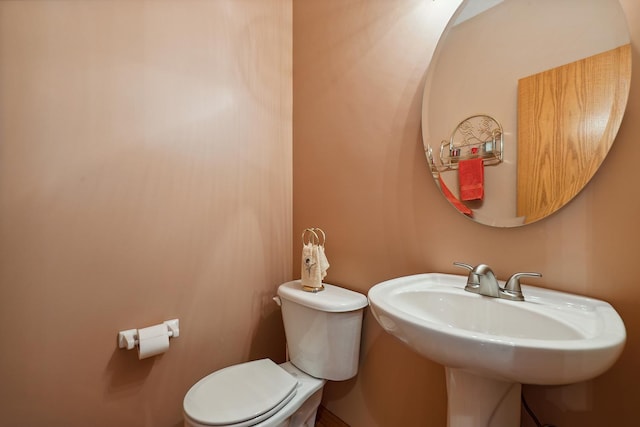 bathroom with a sink and toilet