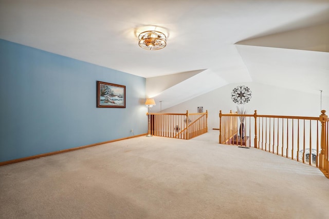 additional living space featuring carpet flooring and vaulted ceiling