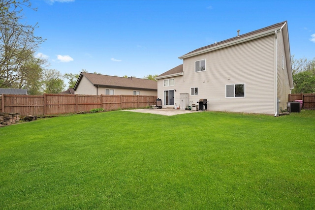 rear view of house with a patio and central air condition unit