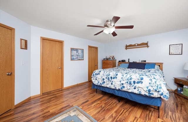 bedroom with wood finished floors, baseboards, and ceiling fan