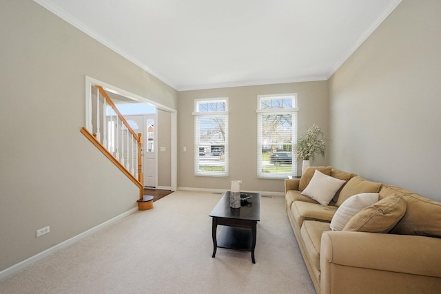 living room with ornamental molding, baseboards, stairway, and light colored carpet