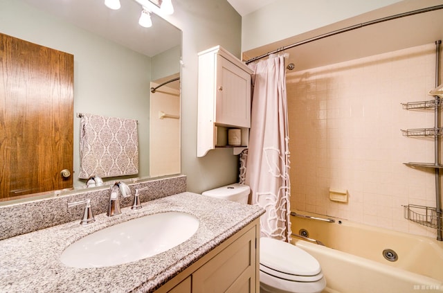 bathroom with toilet, vanity, and shower / tub combo with curtain