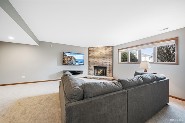 living room with visible vents, baseboards, a brick fireplace, recessed lighting, and carpet flooring