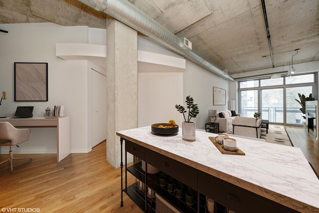 933 W Van Buren St Unit 523, Chicago, IL 60607 - kitchen featuring a sink, stainless steel appliances, light wood finished floors, light countertops, and baseboards