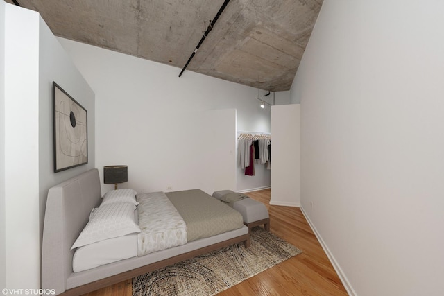 933 W Van Buren St Unit 523, Chicago, IL 60607 - unfurnished living room featuring a fireplace, wood finished floors, and rail lighting
