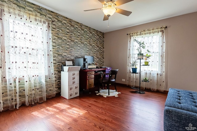 office featuring a ceiling fan and wood finished floors