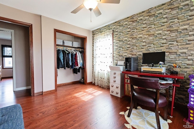 office featuring plenty of natural light, baseboards, a ceiling fan, and wood finished floors
