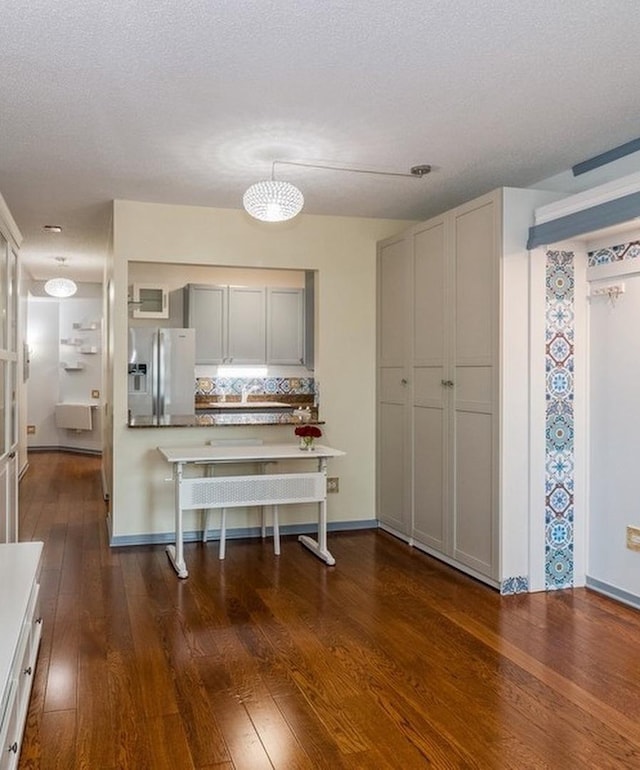 400 N Lasalle Dr Unit 3706, Chicago, IL 60654 - kitchen with tasteful backsplash, a textured ceiling, gray cabinets, stainless steel fridge, and dark wood-style floors