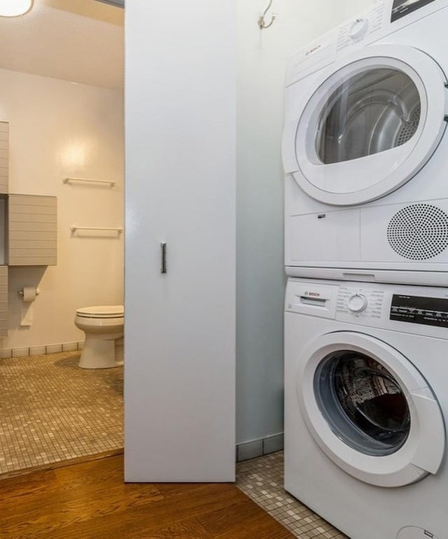 400 N Lasalle Dr Unit 3706, Chicago, IL 60654 - clothes washing area with stacked washer and clothes dryer, wood finished floors, and laundry area