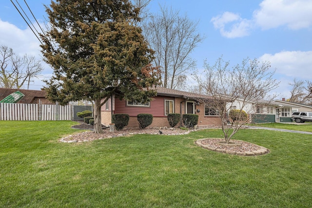 305 166th St, Calumet City, IL 60409 - view of front of property featuring fence, a front lawn, and brick siding