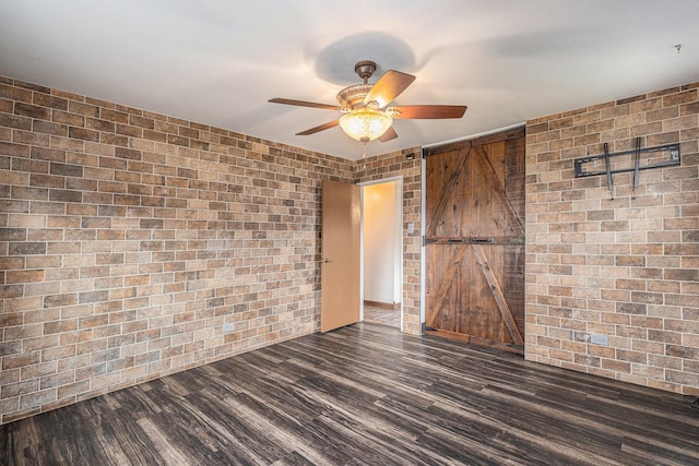 305 166th St, Calumet City, IL 60409 - empty room with ceiling fan, wood finished floors, and brick wall