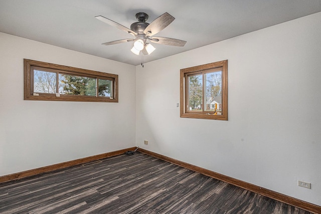 305 166th St, Calumet City, IL 60409 - unfurnished room with a ceiling fan, baseboards, and dark wood-style flooring