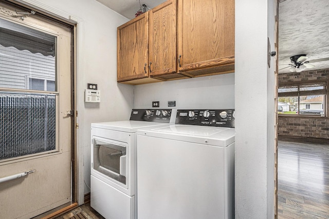 305 166th St, Calumet City, IL 60409 - clothes washing area with wood finished floors, brick wall, washer and dryer, cabinet space, and ceiling fan
