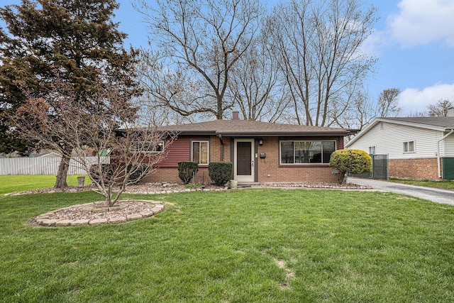 305 166th St, Calumet City, IL 60409 - ranch-style home with brick siding, a chimney, a front lawn, and fence