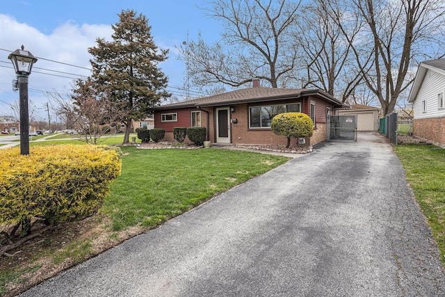 305 166th St, Calumet City, IL 60409 - ranch-style home featuring a gate, a chimney, fence, brick siding, and a front yard