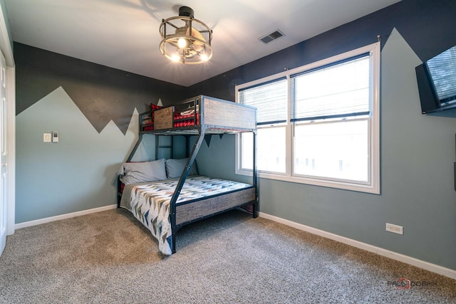 bedroom featuring baseboards, carpet flooring, and visible vents
