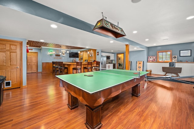 rec room with wet bar, billiards, wood finished floors, and recessed lighting