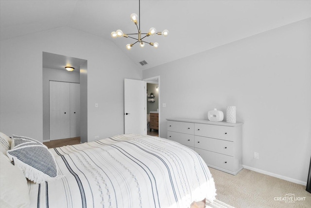bedroom featuring vaulted ceiling, a chandelier, a closet, light colored carpet, and baseboards