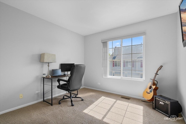 carpeted home office with baseboards