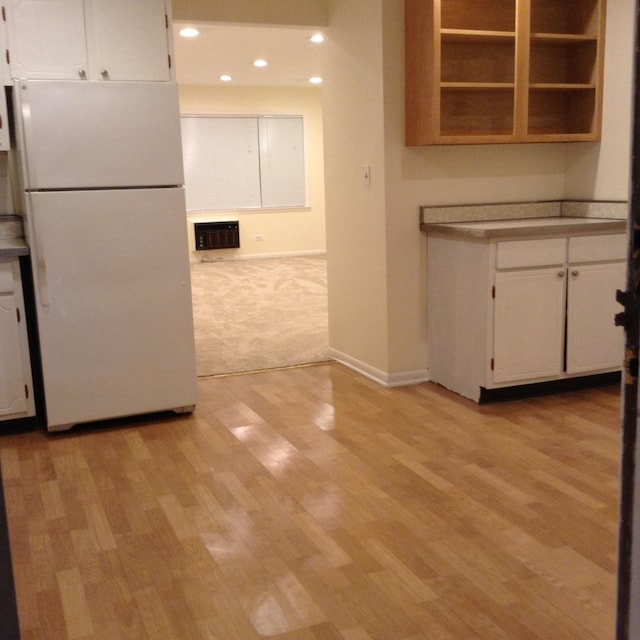 960 Shermer Rd Unit 2, Glenview, IL 60025 - kitchen with freestanding refrigerator, white cabinetry, recessed lighting, light wood-style flooring, and baseboards