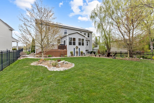 rear view of house with a wooden deck