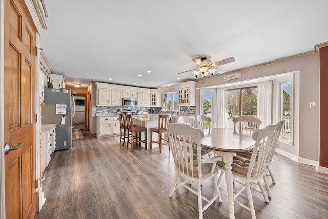 dining area featuring baseboards, a ceiling fan, recessed lighting, and dark wood-style floors