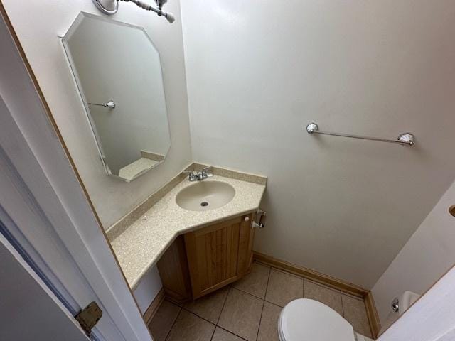 1968 Holbrook Ln, Hoffman Estates, IL 60169 - bathroom with toilet, vanity, baseboards, and tile patterned flooring
