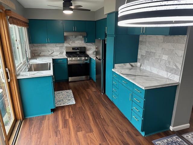1968 Holbrook Ln, Hoffman Estates, IL 60169 - kitchen featuring tasteful backsplash, blue cabinetry, under cabinet range hood, stainless steel appliances, and a sink