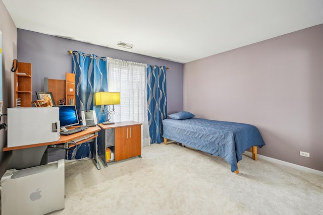 bedroom with carpet floors, baseboards, and visible vents