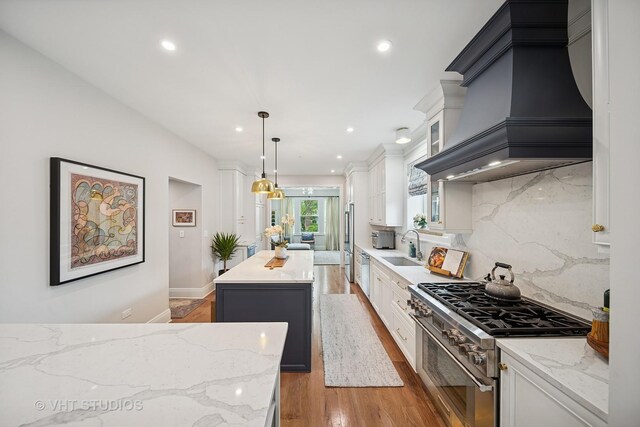 10044 S Leavitt St, Chicago, IL 60643 - kitchen with high quality appliances, a center island, recessed lighting, white cabinetry, and decorative backsplash