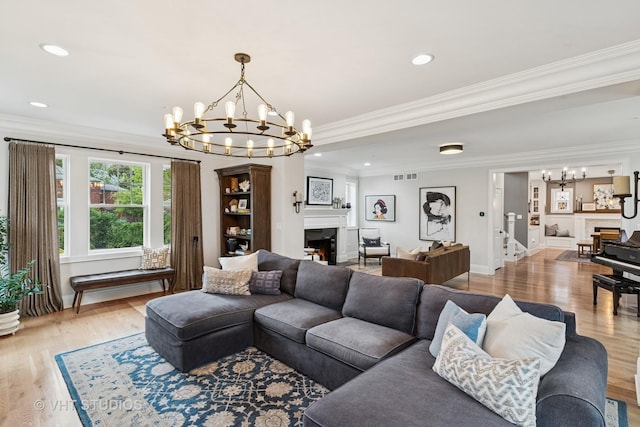 10044 S Leavitt St, Chicago, IL 60643 - living room featuring a chandelier, light wood-style flooring, a fireplace, baseboards, and recessed lighting
