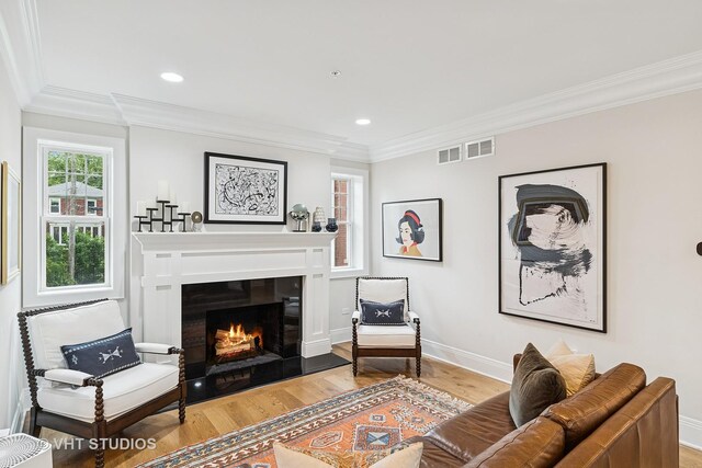 10044 S Leavitt St, Chicago, IL 60643 - living room featuring wood finished floors, baseboards, a warm lit fireplace, ornamental molding, and recessed lighting