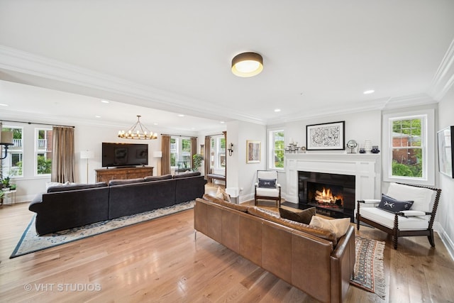 10044 S Leavitt St, Chicago, IL 60643 - living area featuring a glass covered fireplace, ornamental molding, light wood-style flooring, plenty of natural light, and baseboards