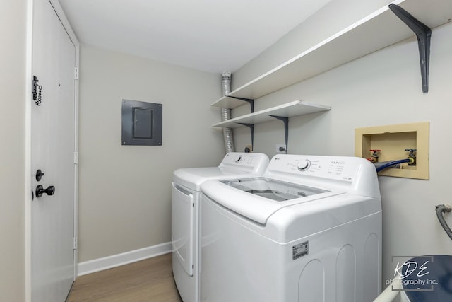 1221 Chalet Rd Unit 28-201, Naperville, IL 60563 - washroom with electric panel, washer and dryer, and light wood finished floors