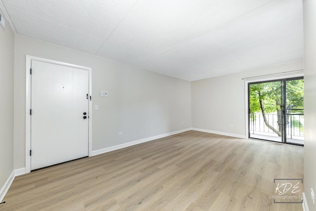 1221 Chalet Rd Unit 28-201, Naperville, IL 60563 - unfurnished room featuring light wood-type flooring and baseboards