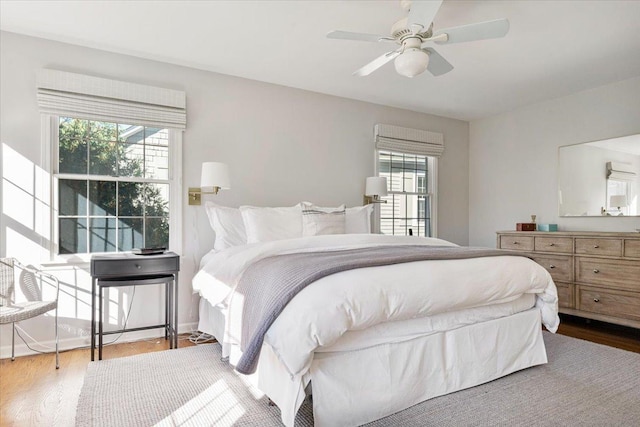 bedroom featuring wood finished floors and ceiling fan