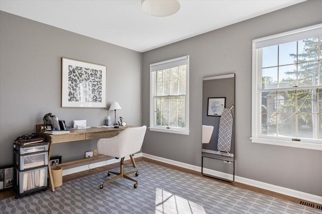 office featuring visible vents and baseboards