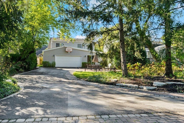 view of front of house featuring aphalt driveway and a garage