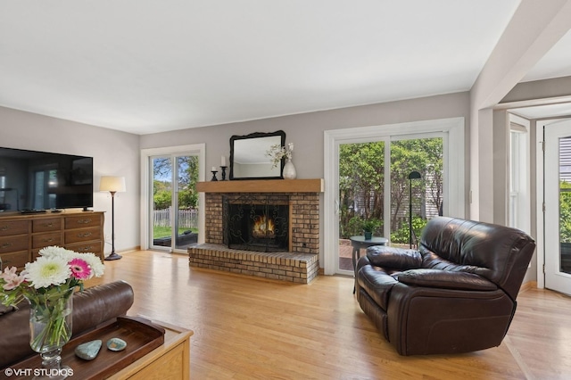 1900 Buckingham Rd, Mundelein, IL 60060 - living room with a fireplace and light wood-type flooring